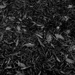 Triple ground black mulch made from dyed hardwood, ideal for landscaping in Alpharetta and Cumming, GA