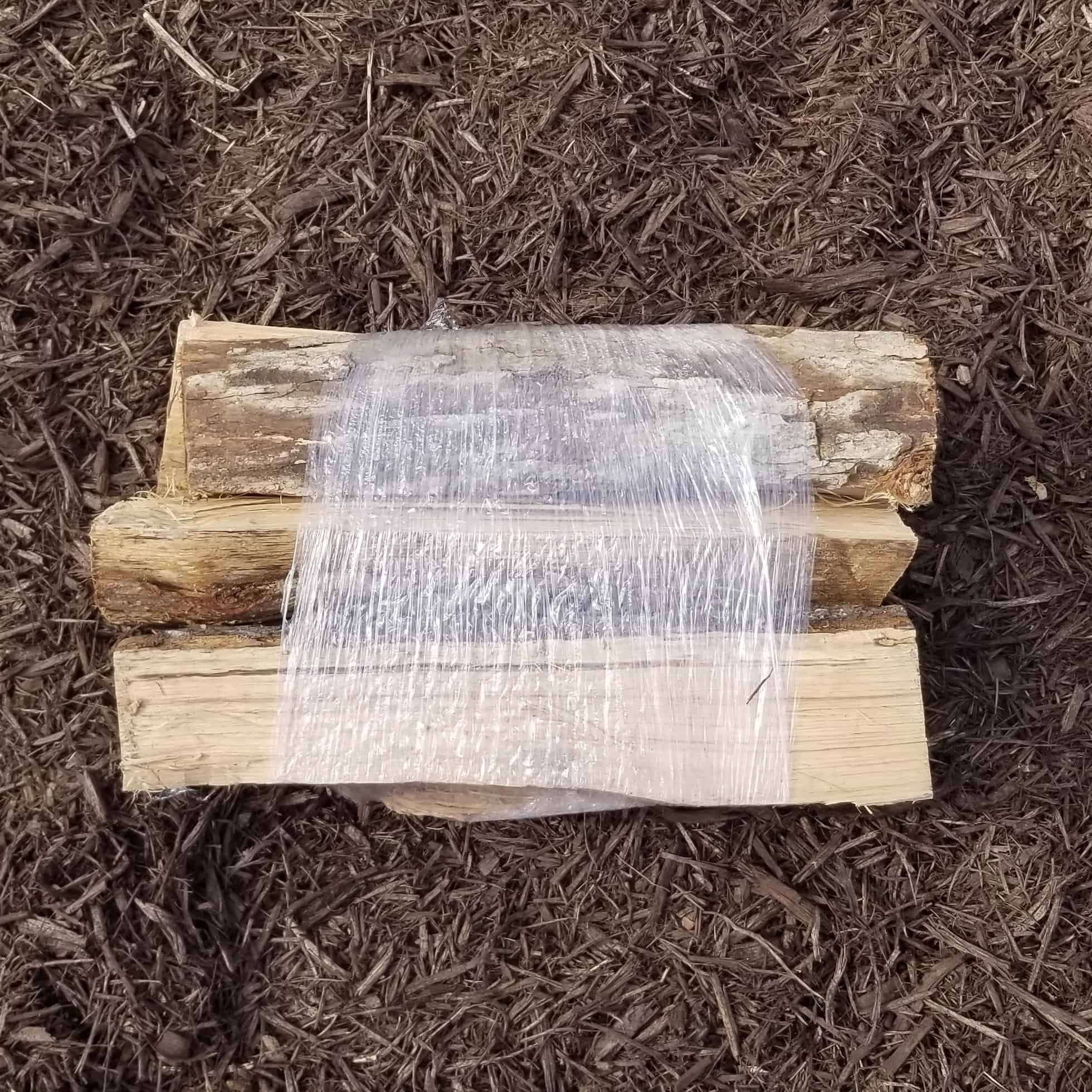 Small bundle of seasoned hardwood firewood for campfires, fireplaces, and backyard use in Alpharetta and Cumming, GA